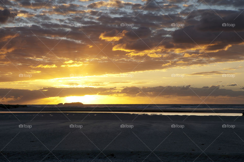 Sunrise around Coffs Harbour with a stunning island on the horizon 