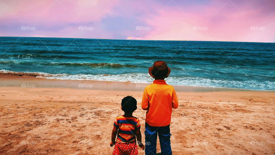 Enjoying summer with ocean with lovely brother