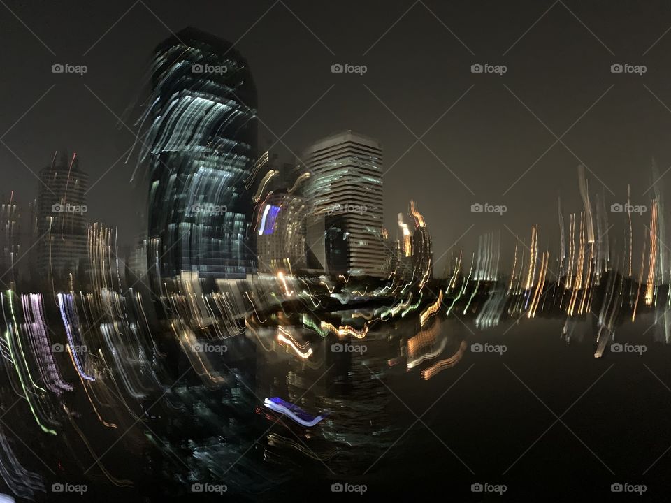 Accidentally moved while took a shot in the park at night in Bangkok