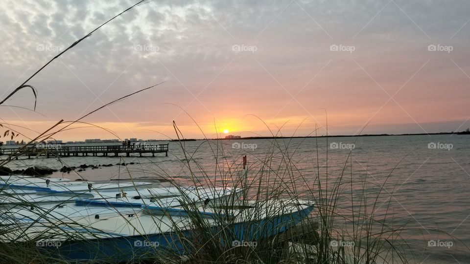 Boats on the water at sunset