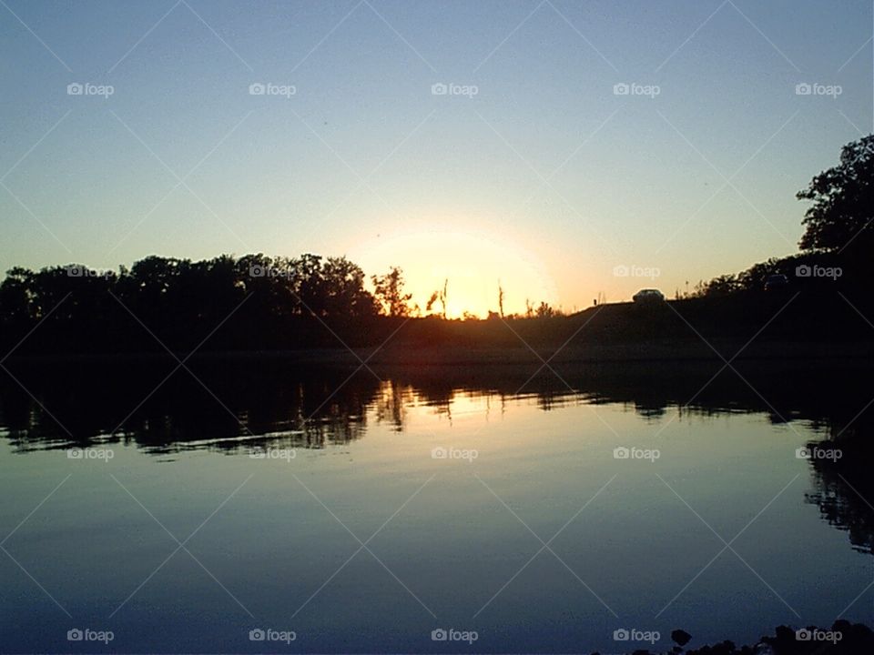 Enjoying the sun set on a lake front summer night