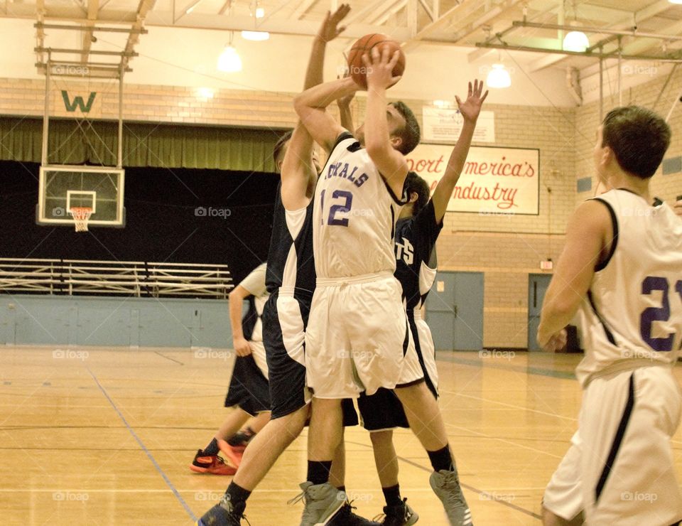 Basketball game, boy trying to make a basket