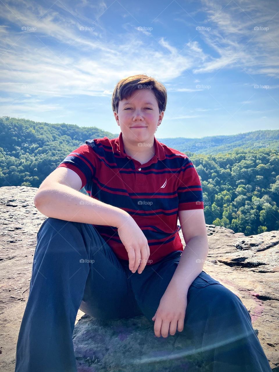 A handsome teenage boy enjoying the overlook