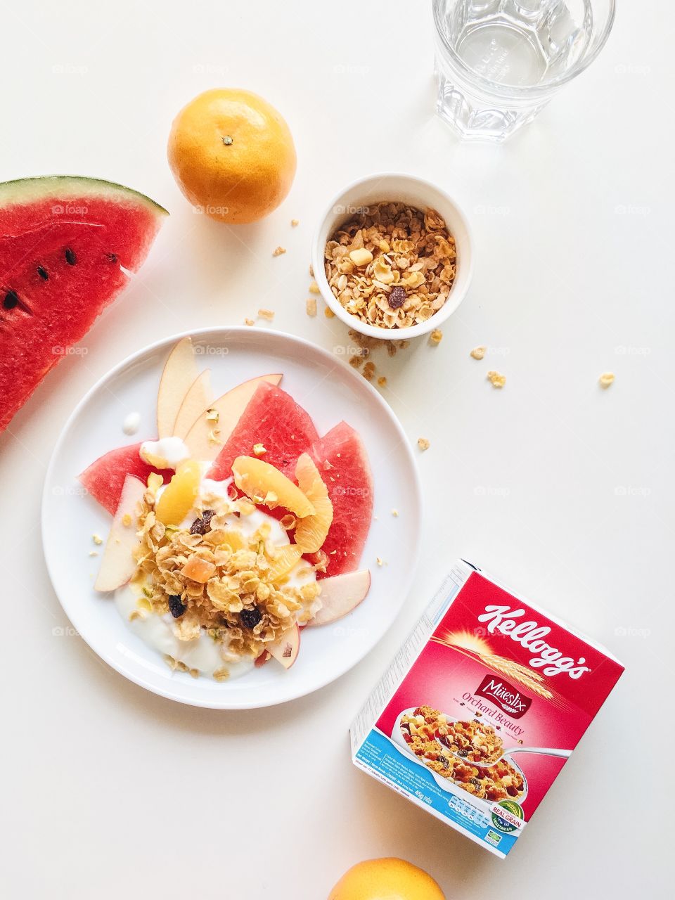 Healthy breakfast with Kellogg's Mueslix, yogurt and fresh mixed fruit.