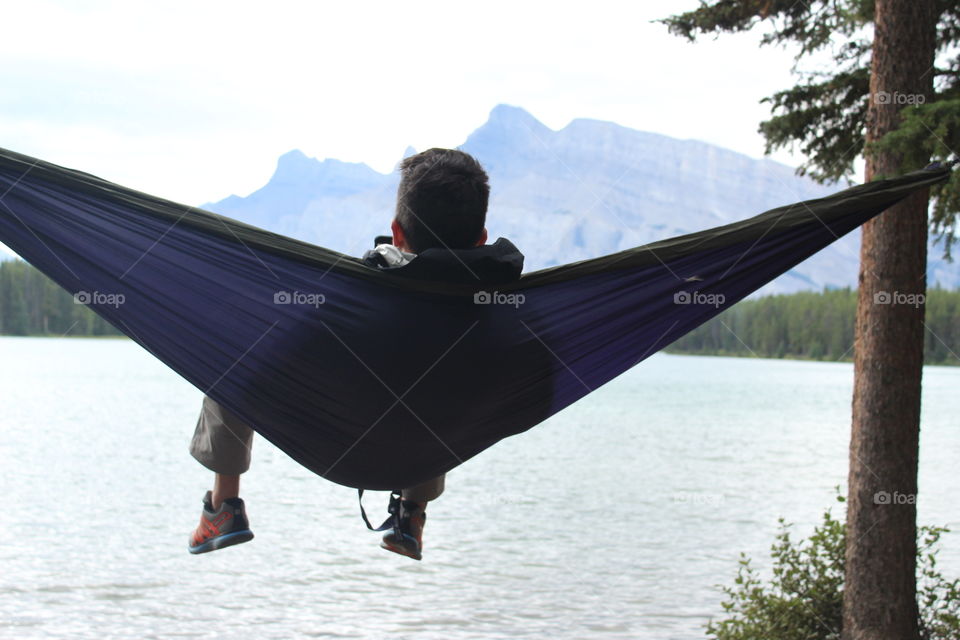 In a hammock looking over a lake 