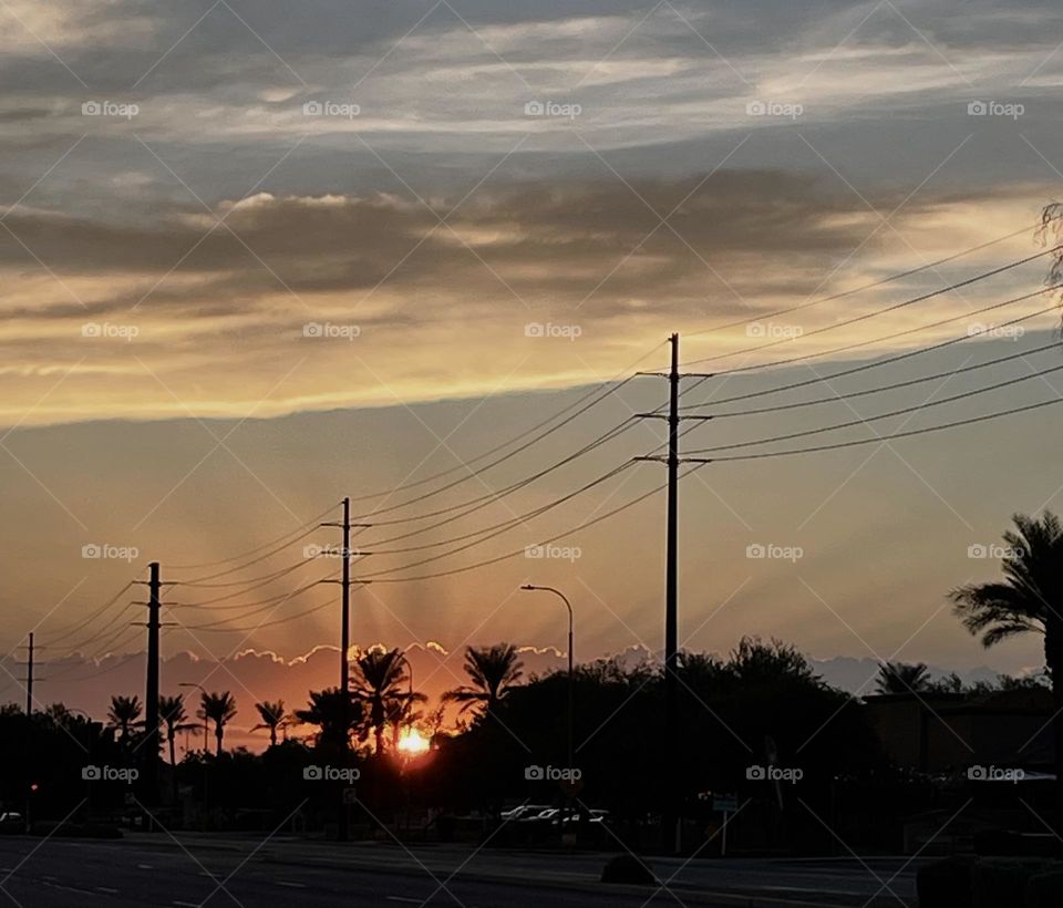 Arizona sunset. I took this picture 3-4 days back while I was out in evening walk. The sunset was so beautiful to look through naked eyes I stoped at the pavement for good 5 min just to gaze at it.
