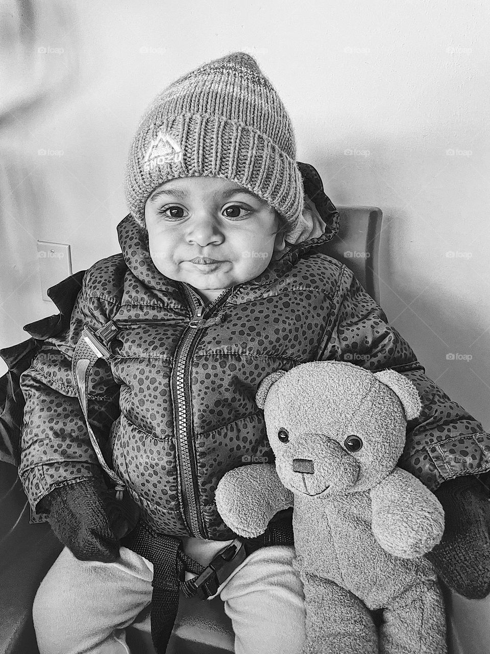 Baby girl has look of disgust on her face, baby is disgusted with waiting, baby is being impatient, baby’s facial expressions, black and white portrait, monochrome photo of disgust, baby is disgusted 