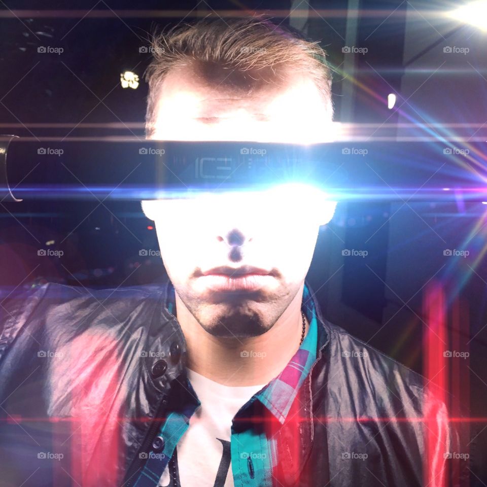 Futuristic portrait. Night time laser portrait of a guy