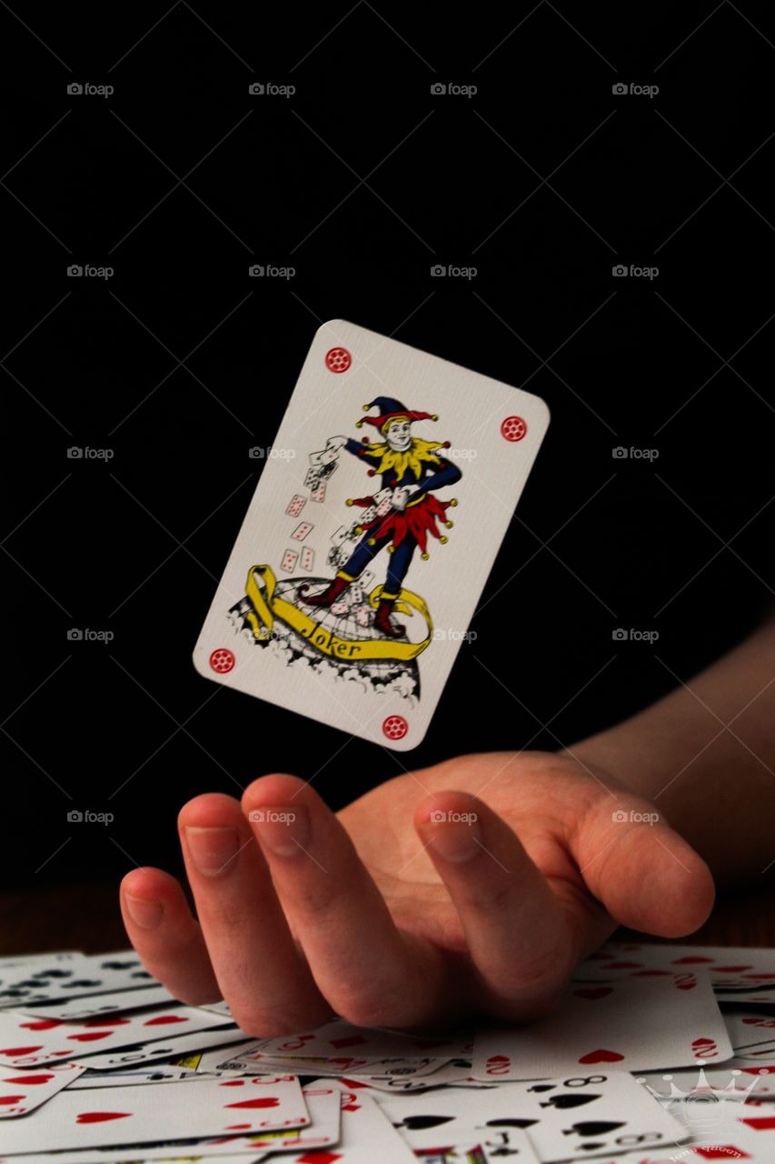 Flying card in hand.