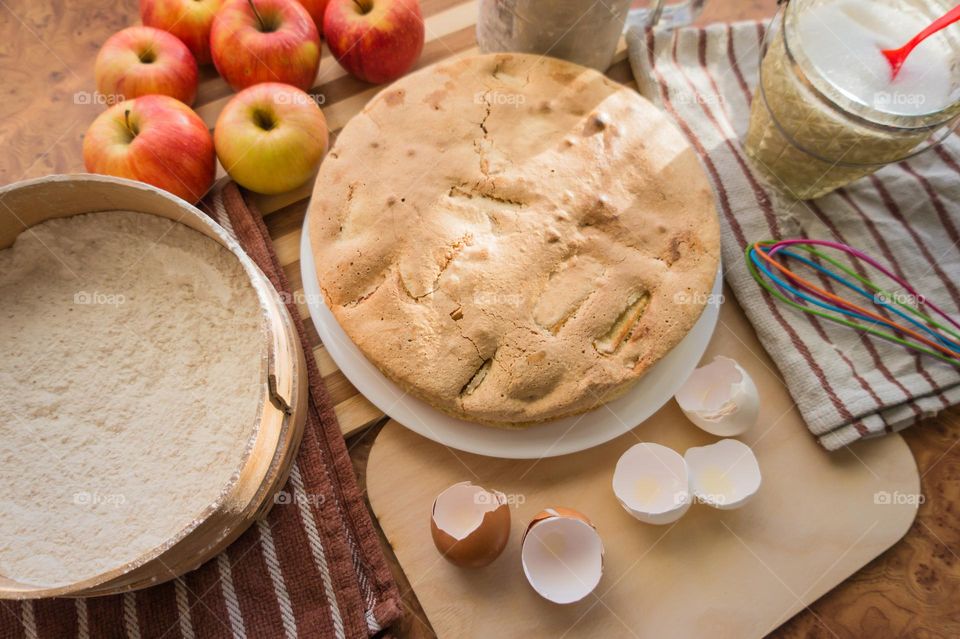 Making homemade puffed apple pie with eggs, sugar and flour.