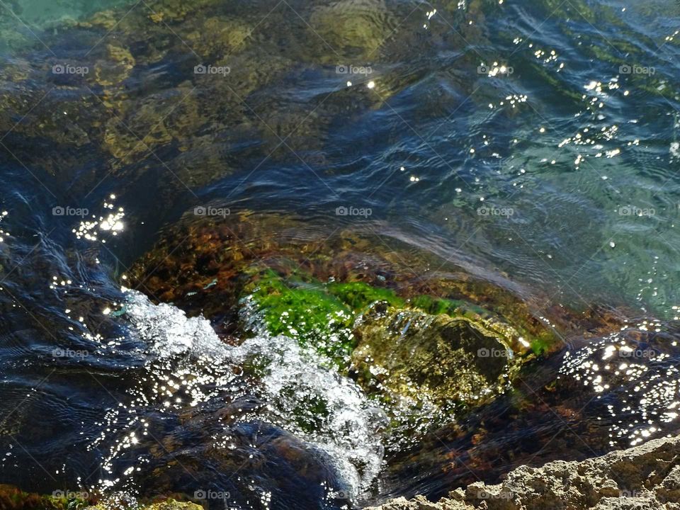 Reliefs on the water with rocks