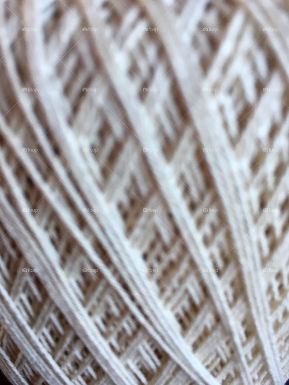 Close up of ball of white string. 