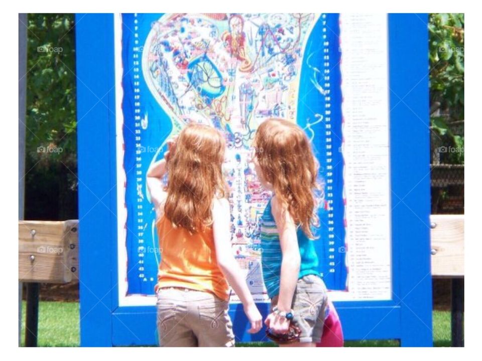 Twins at map of Cedar Point