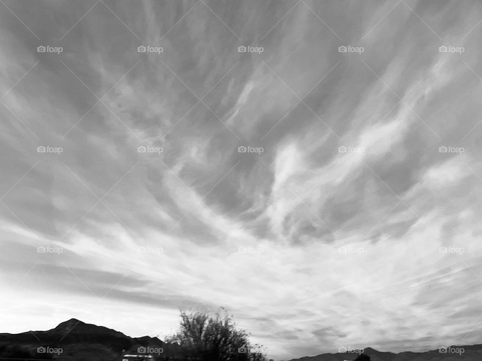 A black and white photo of a cloudy sky.