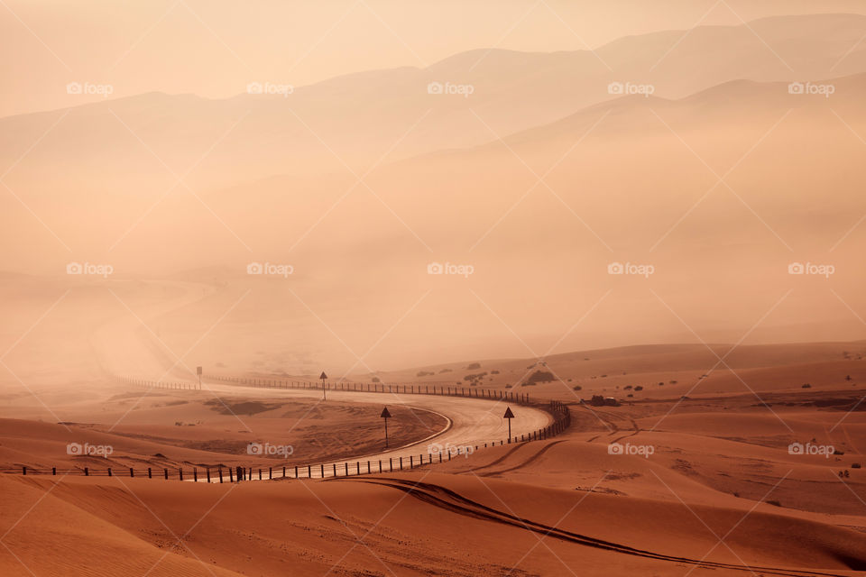 Foggy road in the desert, golden hour