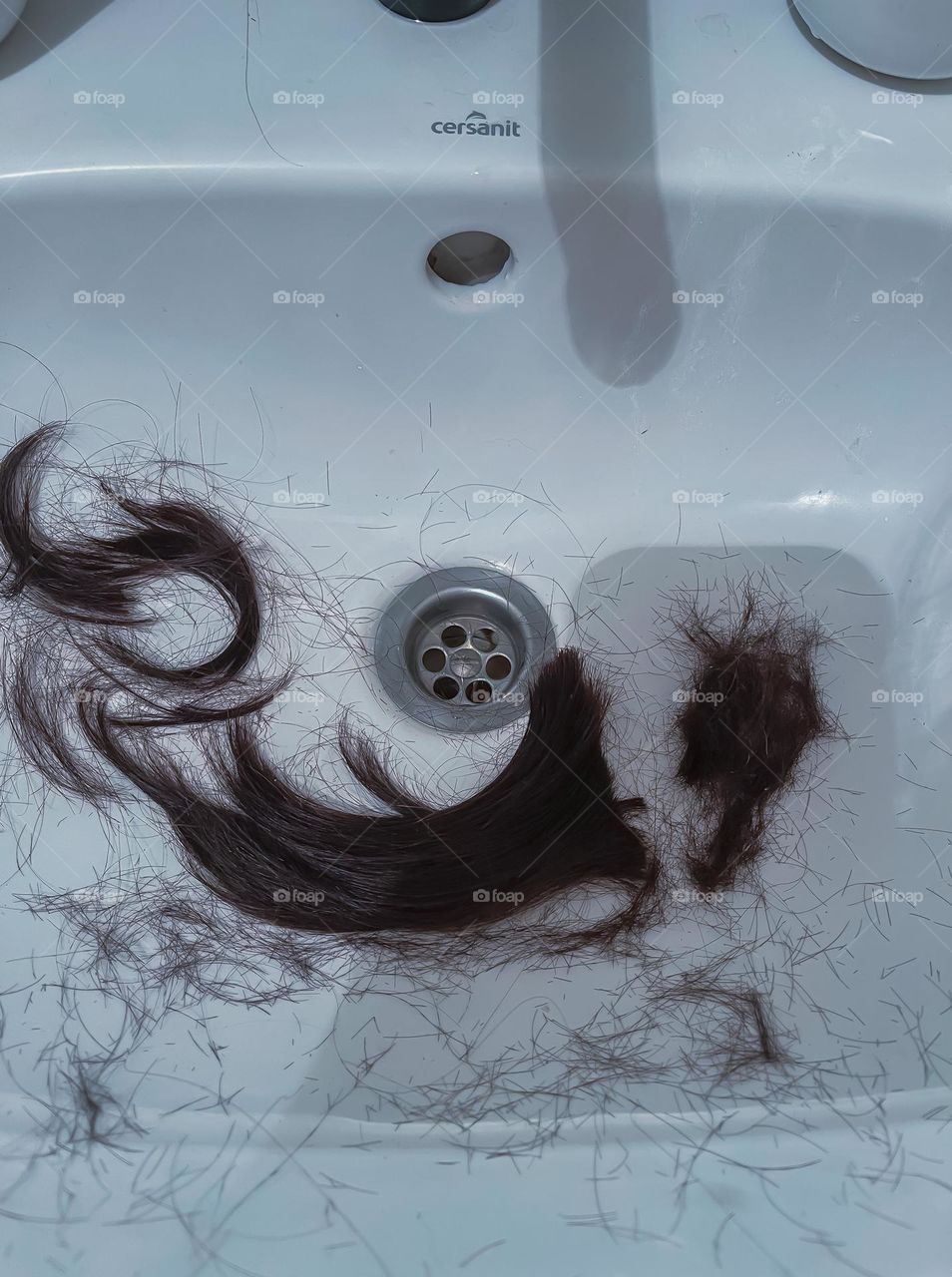 Trimmed hair in the sink