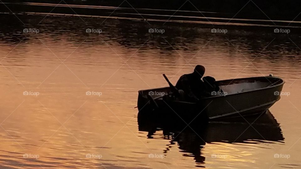 Man and dog in a boat