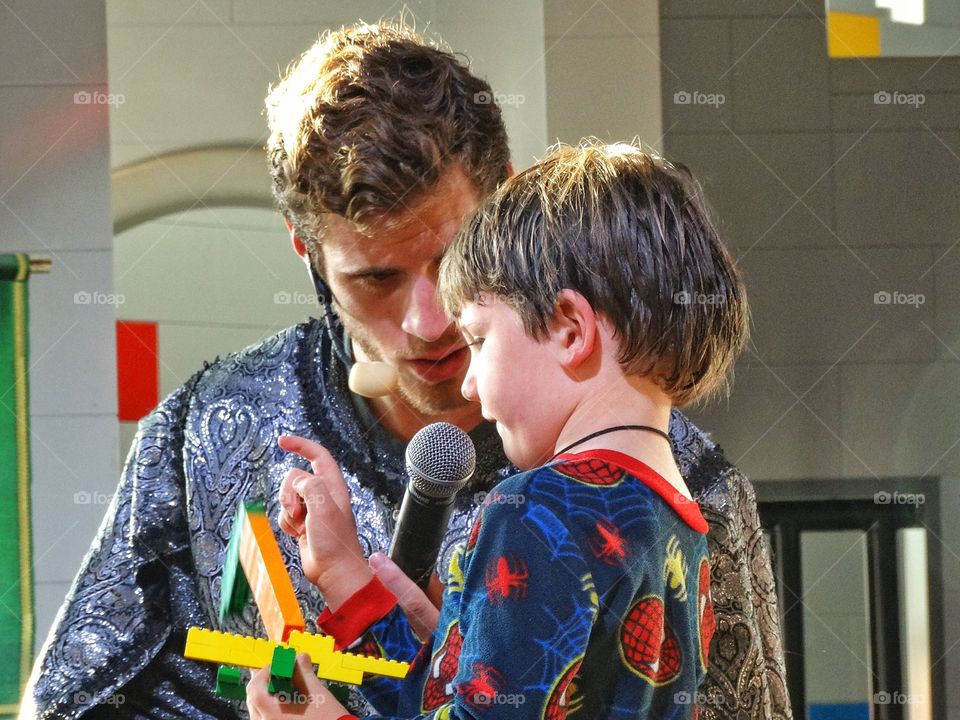 Show And Tell. Young Boy Showing Off His Creation
