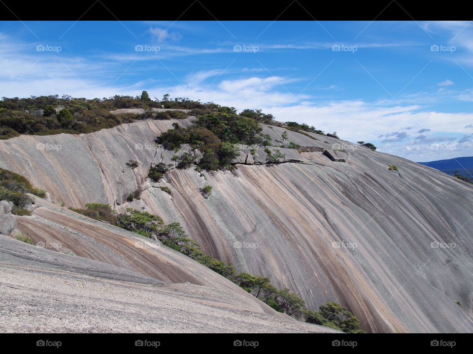 The colours of Bald Rock rising out of the Australian bush near Stanthorpe, Queensland