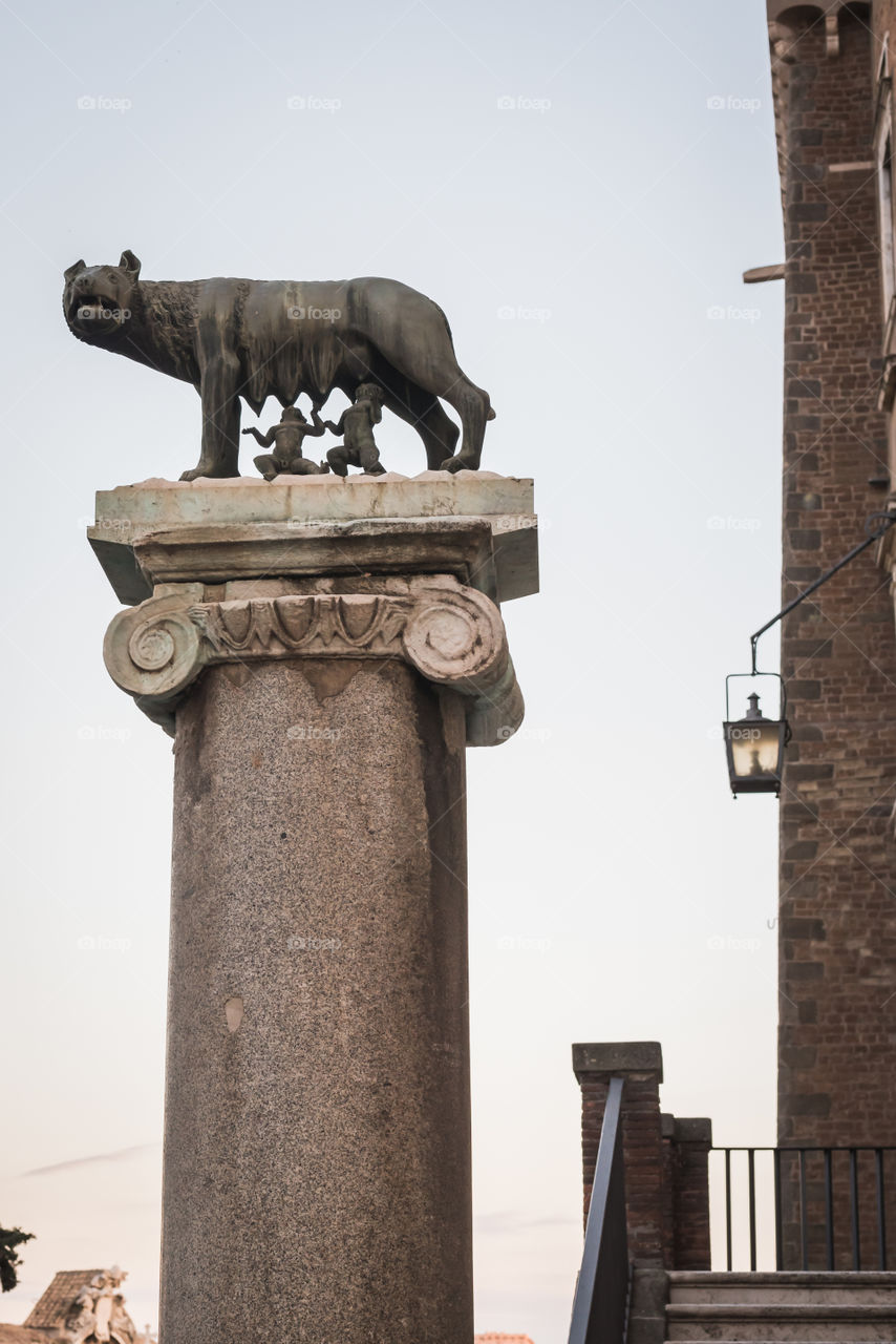 Statue and column of the legend of Romulus and Remus in Rome 