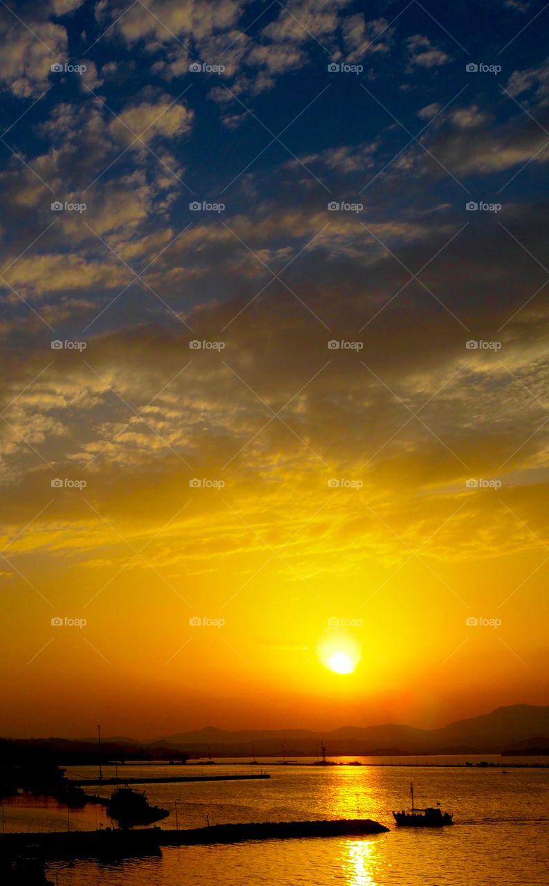 Deep sunset over Corfu Town Old Harbour, Greece