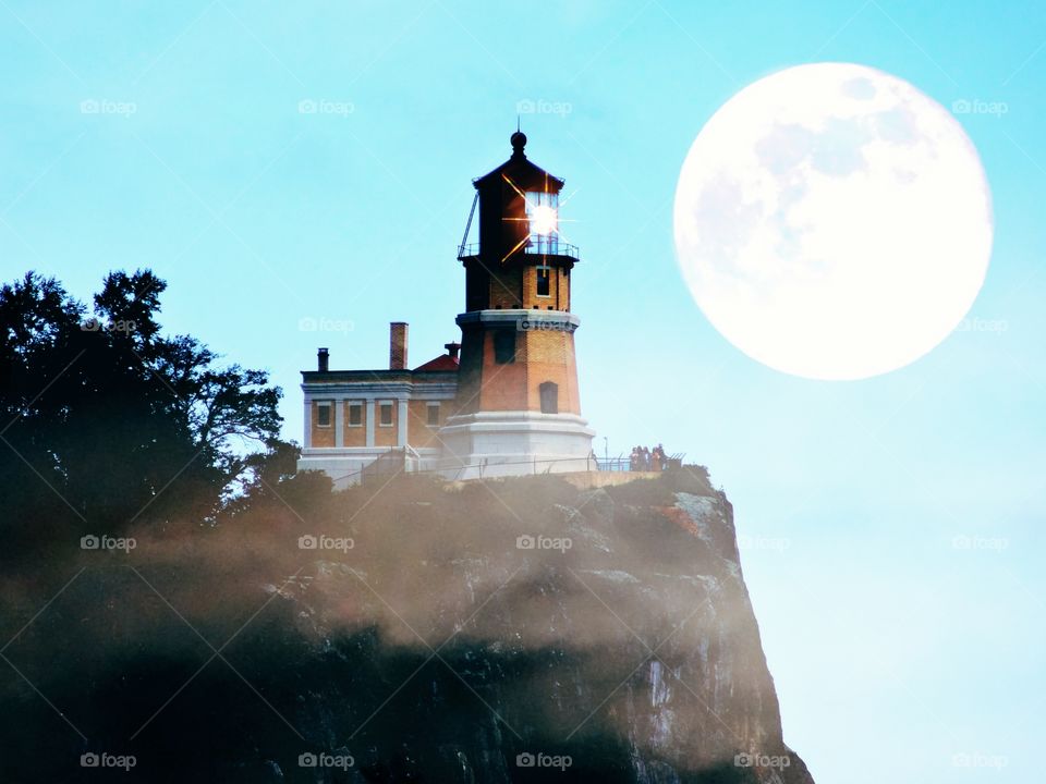 split rock lighthouse Minnesota lake superior scenic route with fantasy moon in background