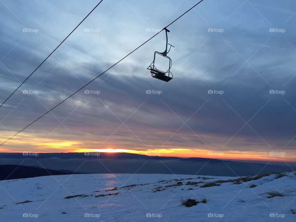 View of ski lift in sunset