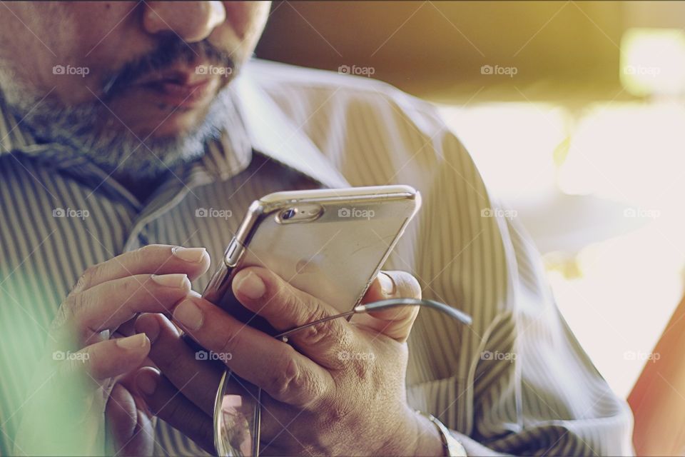 Old man using iPhone 