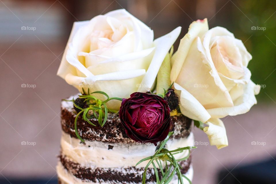 Close-up of cake topper and flower