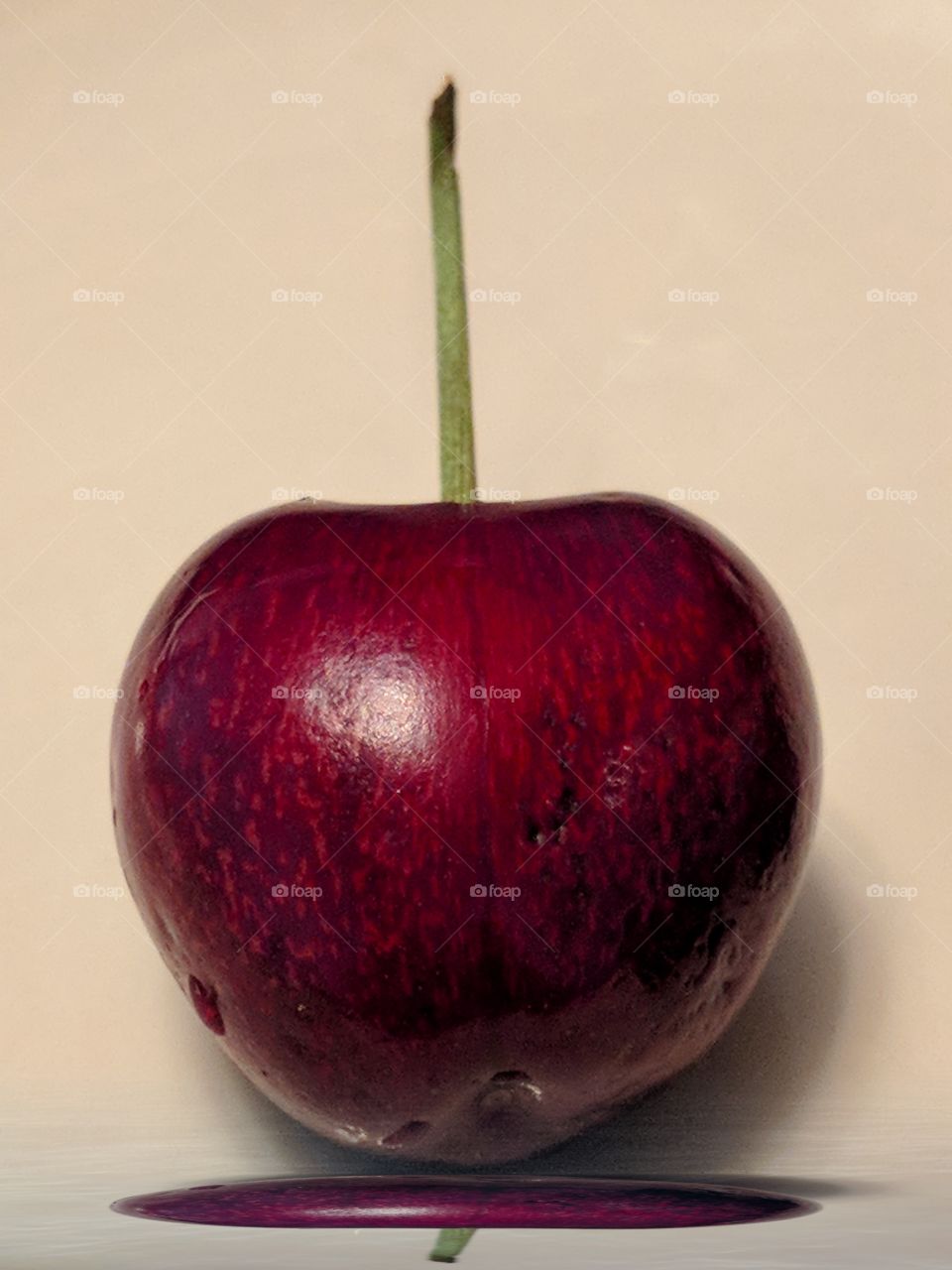 A reflection of a cherry