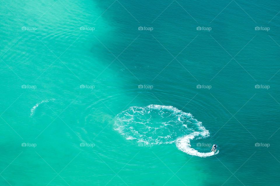 Minimalism. Jetski in the turquoise sea.