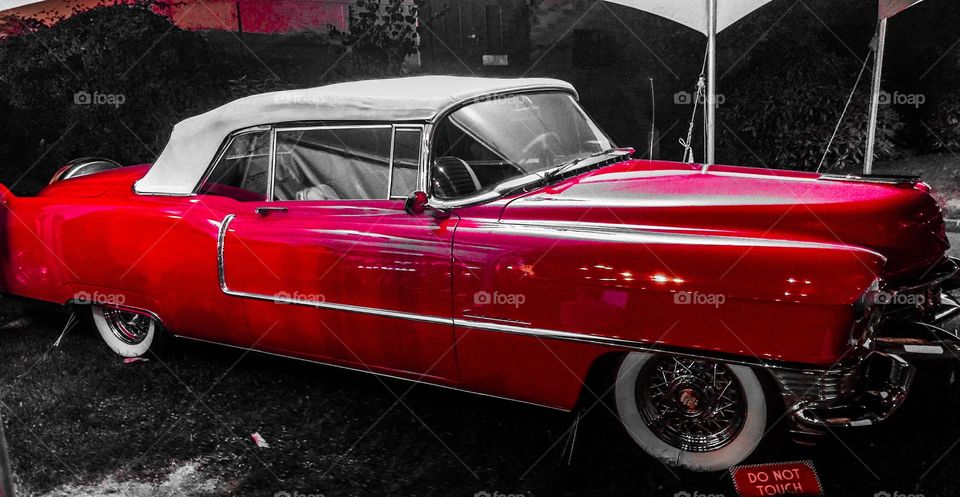 Blazing red Cadillac Fleetwood with drop top with white wall rims using a different filter