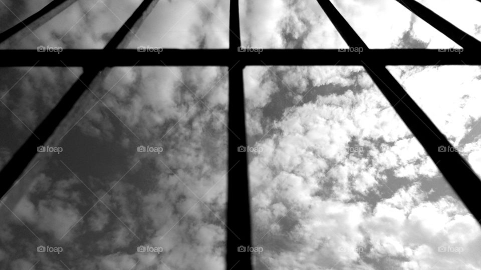 Black and white cloud or sky through silhouette window frame