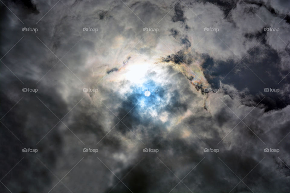 Phenomenal sky. Sunlight behind dark storm clouds. Miracle of nature. Stormy sky.