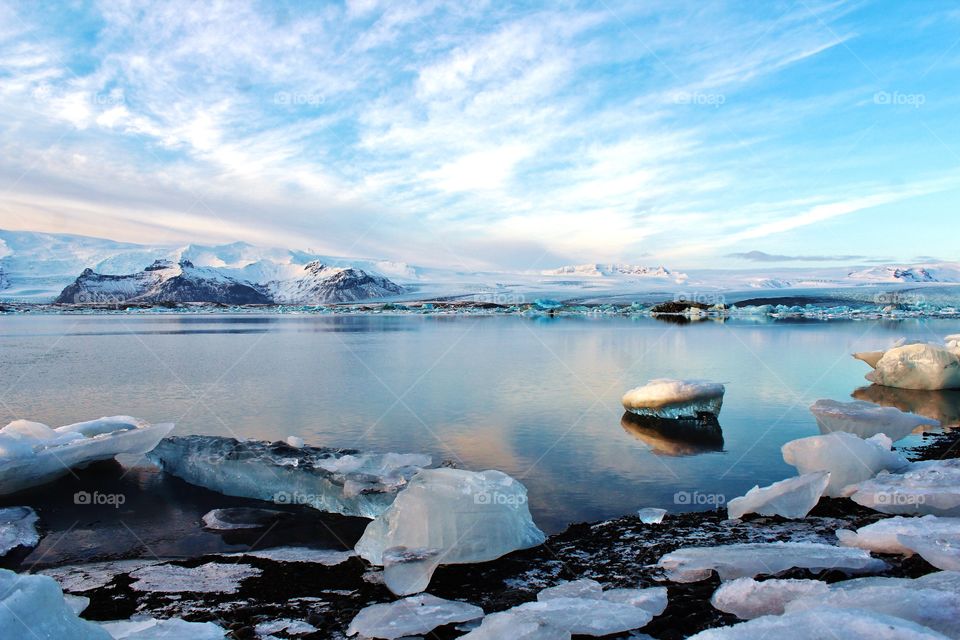 glacier lagoon in Iceland. giant blocks of ice crystal floating on lake mirror