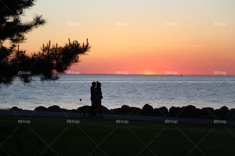 Love in the sunset. Couple in the sunset sun on the beach