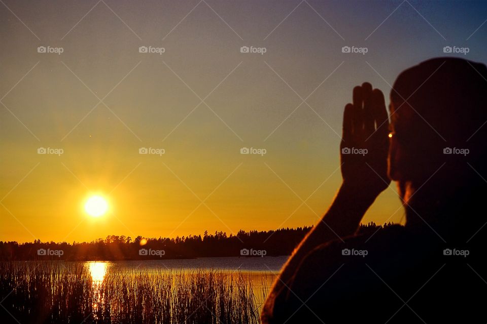 Joyful. Man enjoys the warmth from the sun