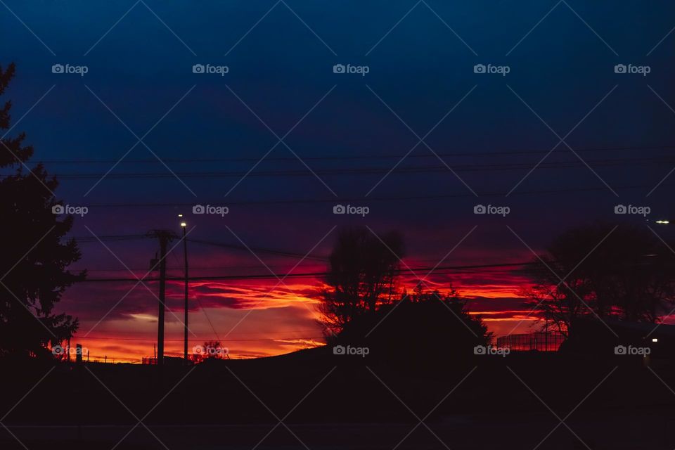 Wild West Wyoming sunset skyline sky silhouette night color colorful vibrant contrast cool picture photo photography neighborhood trees powerlines streetlights city town street nature photography outdoors shades shadows shapes