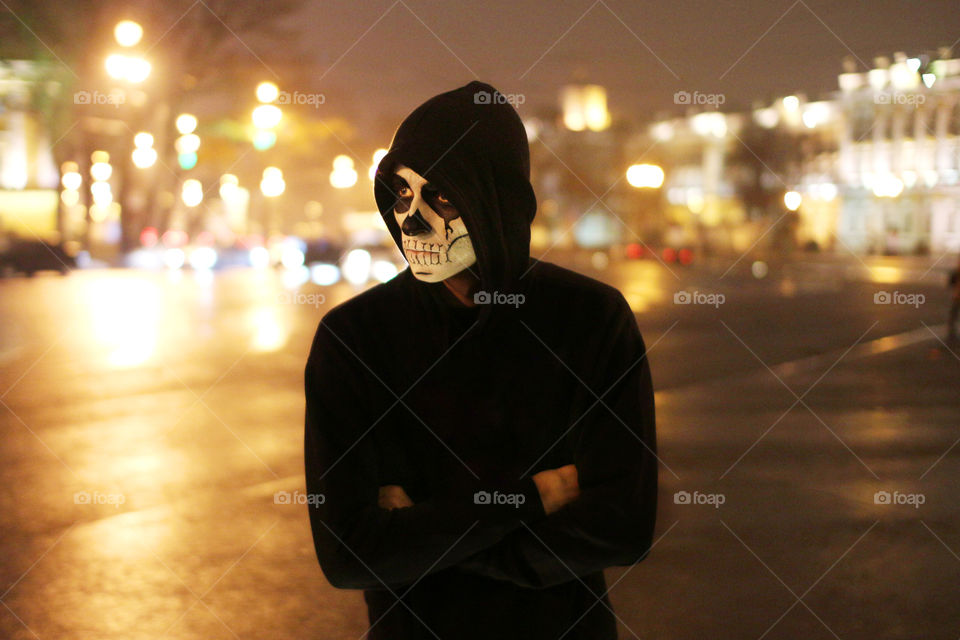Man wearing scared mask during halloween