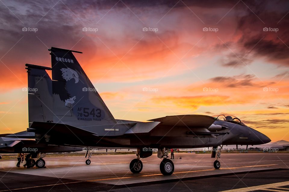 F15 fighter jet prepares to depart at sunset. 