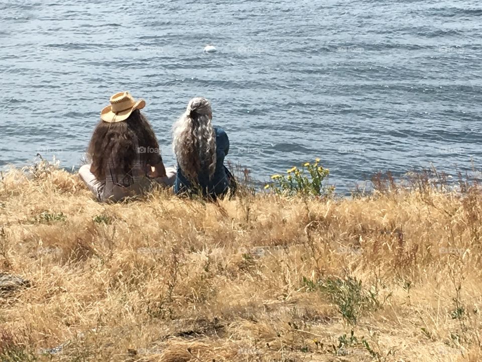 Old couple looking at the ocean 