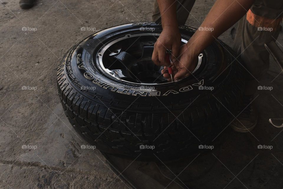 Automotive rubber tire maintenance, tire service and repair