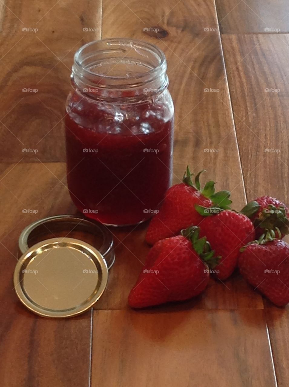 Homemade strawberry jam in a jar .