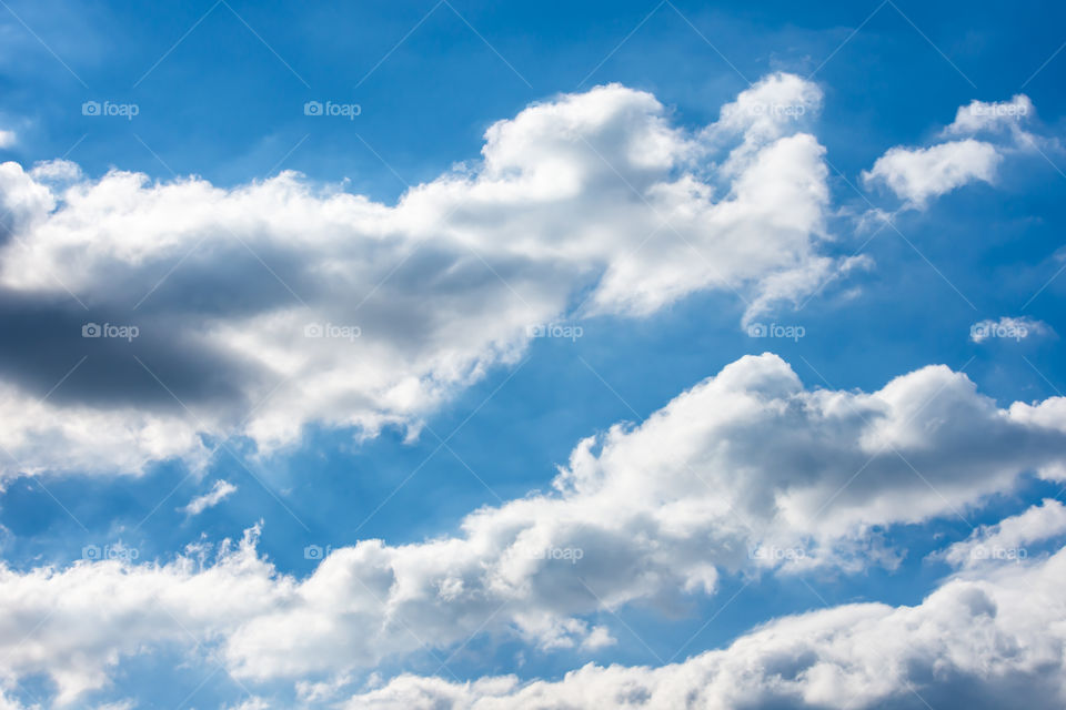 The beauty of the sky with clouds and the sun.