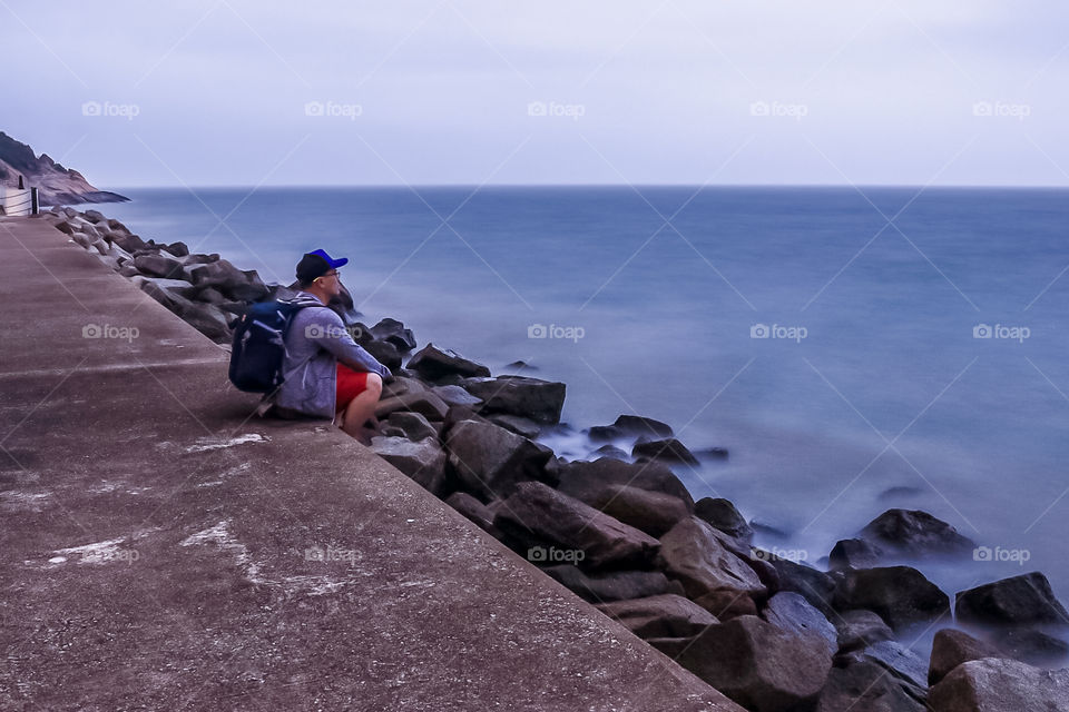 Relaxing at the Shoreline while embracing the Tranquility of being alone after a Landscape adventure.