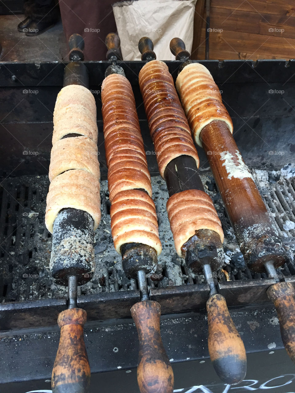 Trdlo is a dough that's wound in a spiral around a large pipe then cooked over fire and coated with sugar and cinnamon. It's crispy on the outside, doughy on the inside and delicious!