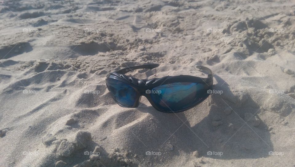 sunglasses in the sand