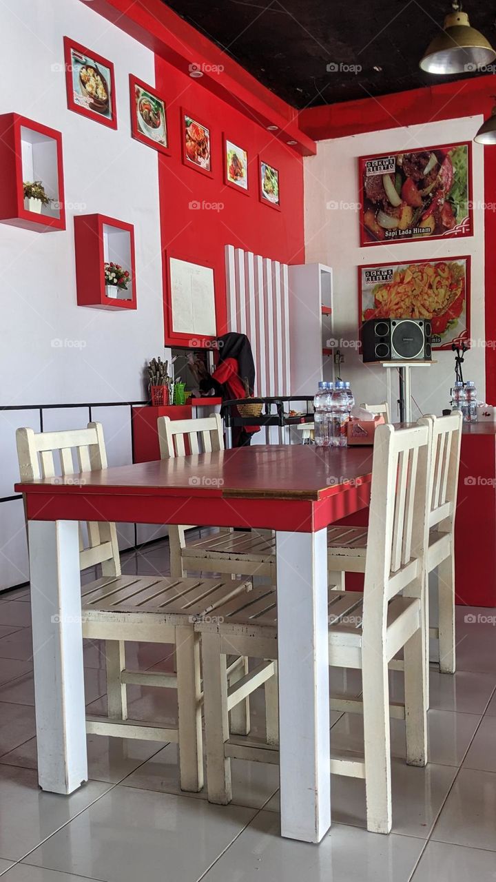 Table set at ocky's resto with red white colour dominated