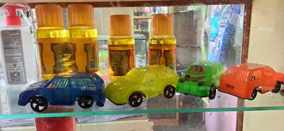 Baby's toy and liquid in shop