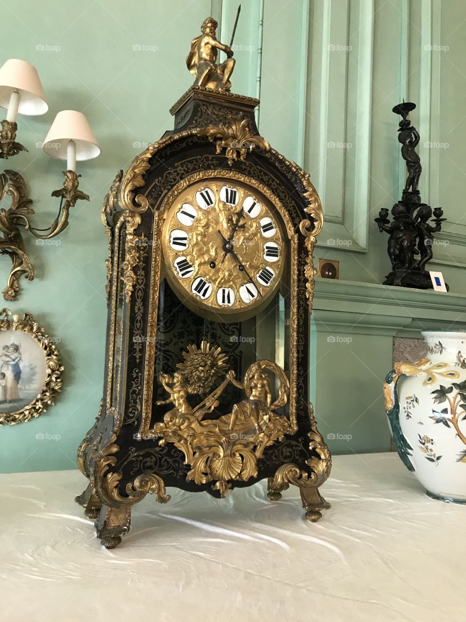 An antique clock so rich it presents as laden with gold, with that description it is surely a wanted treasure.